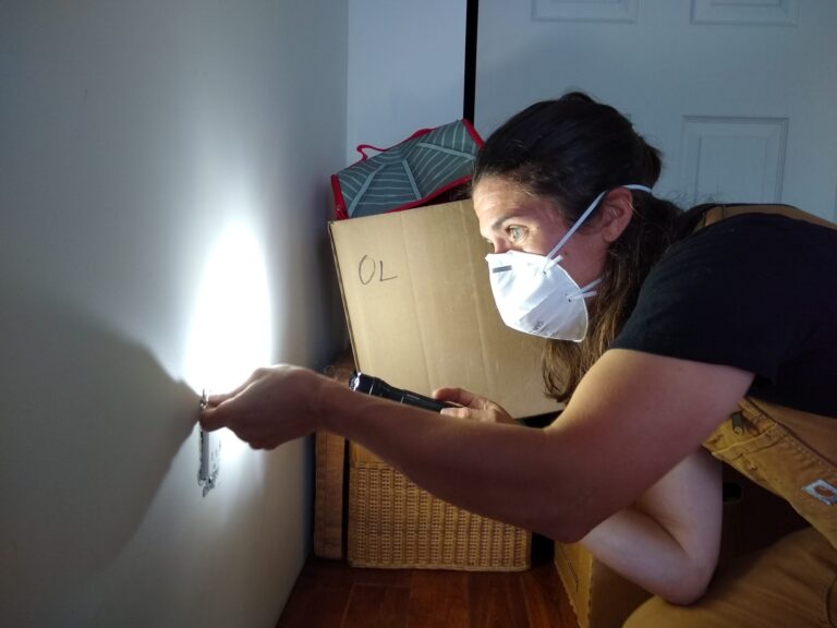 An Energy Advisor conducts a home evaluation