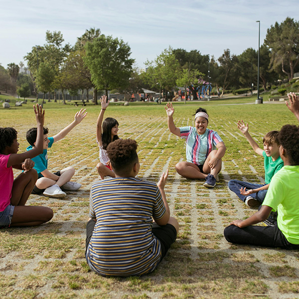 students sitting in park
