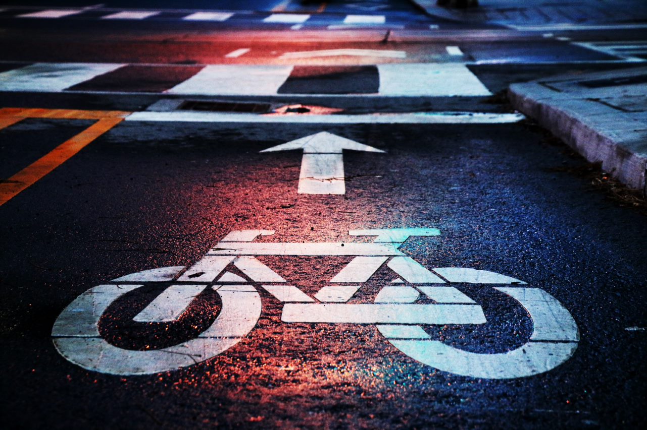 Painted bicycle lane symbol on a road.